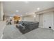 Finished basement with sectional sofa and home gym at 5875 E Weaver Cir, Centennial, CO 80111