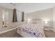 Basement bedroom with floral bedding and mirrored closet at 5875 E Weaver Cir, Centennial, CO 80111