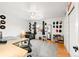 Bedroom with wood floors, lots of light, and a desk area at 5875 E Weaver Cir, Centennial, CO 80111