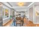 Spacious dining area with hardwood floors and a view into the living room at 5875 E Weaver Cir, Centennial, CO 80111