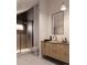 Sleek bathroom featuring a modern vanity, a walk-in shower, and stylish fixtures at 4817 W 10Th Ave, Denver, CO 80204