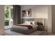 Serene bedroom with access to a balcony, featuring a comfortable bed and soft, neutral colors at 4817 W 10Th Ave, Denver, CO 80204