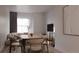 Cozy dining room featuring a modern table with seating for six and a comfortable sofa at 4817 W 10Th Ave, Denver, CO 80204