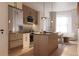 Modern kitchen featuring stainless steel appliances, stylish light fixtures, and a functional island at 4817 W 10Th Ave, Denver, CO 80204