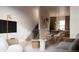 Contemporary living room showcasing an open floor plan with stairs and elegant furnishings at 4817 W 10Th Ave, Denver, CO 80204