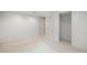 Finished basement area showcasing closet, neutral carpet, and painted trim at 5502 E Center Ave, Denver, CO 80246