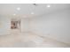 Basement featuring open space with carpet and stairs at 5502 E Center Ave, Denver, CO 80246