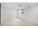 Basement featuring open space with carpet and a window at 5502 E Center Ave, Denver, CO 80246