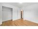 Bright bedroom with closet and hardwood floors at 5502 E Center Ave, Denver, CO 80246