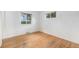 Bedroom with hardwood floors and natural light from two windows at 5502 E Center Ave, Denver, CO 80246