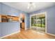 Dining area near a sliding glass door offers backyard access and connects to the kitchen, creating an open flow at 5502 E Center Ave, Denver, CO 80246
