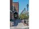 Walking street scene with shops, restaurants and decorative street lamps at 7275 S Gaylord St # I09, Littleton, CO 80122