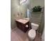 Well-lit bathroom featuring a vanity with a sink and a decorative shelving unit at 11207 Osage Cir # B, Northglenn, CO 80234
