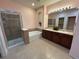 Bathroom features a shower, soaking tub, double vanity, and tile flooring for a luxurious spa-like experience at 11207 Osage Cir # B, Northglenn, CO 80234