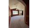 Spacious bedroom with high ceilings, large window, ceiling fan and plush carpeting at 11207 Osage Cir # B, Northglenn, CO 80234