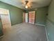 Bedroom featuring neutral walls, carpet, ceiling fan, and walk-in closet at 11207 Osage Cir # B, Northglenn, CO 80234