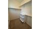 Walk-in closet with shelving providing ample storage and organization space at 11207 Osage Cir # B, Northglenn, CO 80234