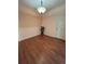 Cozy dining room with wood floors, a charming light fixture, and natural light at 11207 Osage Cir # B, Northglenn, CO 80234