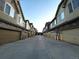 Row of townhomes showcasing garages and appealing architectural details at 11207 Osage Cir # B, Northglenn, CO 80234