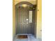 Elegant front door with transom window, stylish hardware, and warm lighting, enhancing curb appeal at 11207 Osage Cir # B, Northglenn, CO 80234