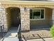 Attractive townhome facade with stone accents, manicured front yard, and welcoming entrance at 11207 Osage Cir # B, Northglenn, CO 80234