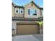 Two car garage door highlighting the home's exterior and convenient parking at 11207 Osage Cir # B, Northglenn, CO 80234