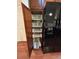 Pantry with multiple wire storage baskets and a modern black refrigerator with water dispenser at 11207 Osage Cir # B, Northglenn, CO 80234