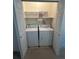 A laundry room closet contains a washer and dryer at 11207 Osage Cir # B, Northglenn, CO 80234