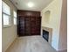 A living room featuring built-in bookcases and fireplace at 11207 Osage Cir # B, Northglenn, CO 80234