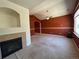 Spacious living room featuring a fireplace, ceiling fan, and neutral-toned walls with decorative border at 11207 Osage Cir # B, Northglenn, CO 80234