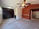 Cozy living room with fireplace, custom shelving, and natural light at 11207 Osage Cir # B, Northglenn, CO 80234