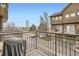 Balcony of condo unit with an outdoor grill and view to the parking area and other buildings at 18847 E Yale Cir # D, Aurora, CO 80013