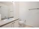 Clean bathroom with single sink vanity and toilet at 18847 E Yale Cir # D, Aurora, CO 80013