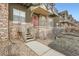 Townhome entrance with stone steps and landscaping at 18847 E Yale Cir # D, Aurora, CO 80013