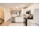 Bright kitchen with stainless steel appliances and white cabinetry at 18847 E Yale Cir # D, Aurora, CO 80013