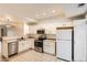 Bright eat-in kitchen with stainless steel appliances and white cabinetry at 18847 E Yale Cir # D, Aurora, CO 80013