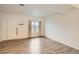 Living room with hardwood floors and large window at 18847 E Yale Cir # D, Aurora, CO 80013