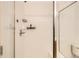 Shower with glass enclosure and storage at 18847 E Yale Cir # D, Aurora, CO 80013