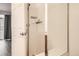 Clean and modern shower featuring white tiles and a glass door at 18847 E Yale Cir # D, Aurora, CO 80013