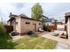 Backyard featuring a fire pit, outdoor seating and green grass at 840 S Pennsylvania St, Denver, CO 80209