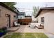 Inviting backyard featuring a concrete patio with outdoor seating, string lights, and a fire pit at 840 S Pennsylvania St, Denver, CO 80209