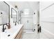 Modern bathroom with double sinks, walk-in shower, and stylish black fixtures at 840 S Pennsylvania St, Denver, CO 80209