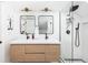 Modern bathroom with a double vanity, sleek mirrors, and a frameless glass shower at 840 S Pennsylvania St, Denver, CO 80209