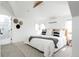 Bright bedroom featuring neutral decor, a comfortable bed, and a view of the ensuite bathroom at 840 S Pennsylvania St, Denver, CO 80209