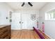 Bright bedroom features hardwood floors, closet and colorful decor at 840 S Pennsylvania St, Denver, CO 80209