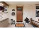 Charming front porch with a brick facade, seating area, and a decorative 'HELLO' welcome mat at 840 S Pennsylvania St, Denver, CO 80209