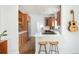 A functional kitchen with stainless appliances, wood cabinets and a breakfast bar with seating at 840 S Pennsylvania St, Denver, CO 80209