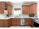 Well-appointed kitchen with custom cabinets, stainless steel appliances, and a bright window at 840 S Pennsylvania St, Denver, CO 80209