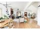 Spacious, open-concept living room with hardwood floors, modern lighting, and view into the dining area at 840 S Pennsylvania St, Denver, CO 80209