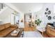 Spacious living room with hardwood floors, open layout to dining area, and stylish contemporary decor at 840 S Pennsylvania St, Denver, CO 80209